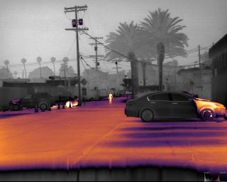 Color frame - parked vehicles and man walking - seen by Niels 12 SXGA thermal camera