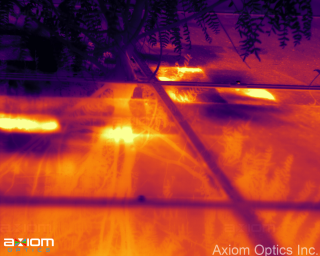 Daytime solar panel thermal imaging showing overheating cell indicating a defect